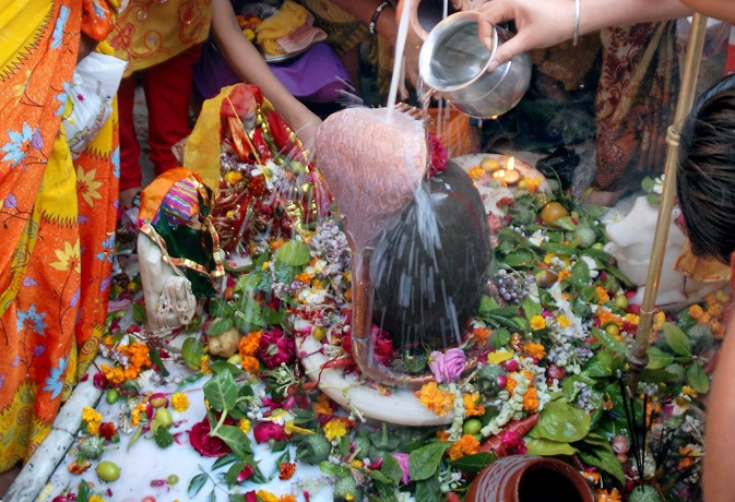 B-31, KOTA-230201, FEBRUARY 23, 2009:  Kota:  Devotees pour milk on Shivling at Neelkanth Mahadev temple on the occasion of Mahashivrathri in Kota on Monday.  PTI Photo