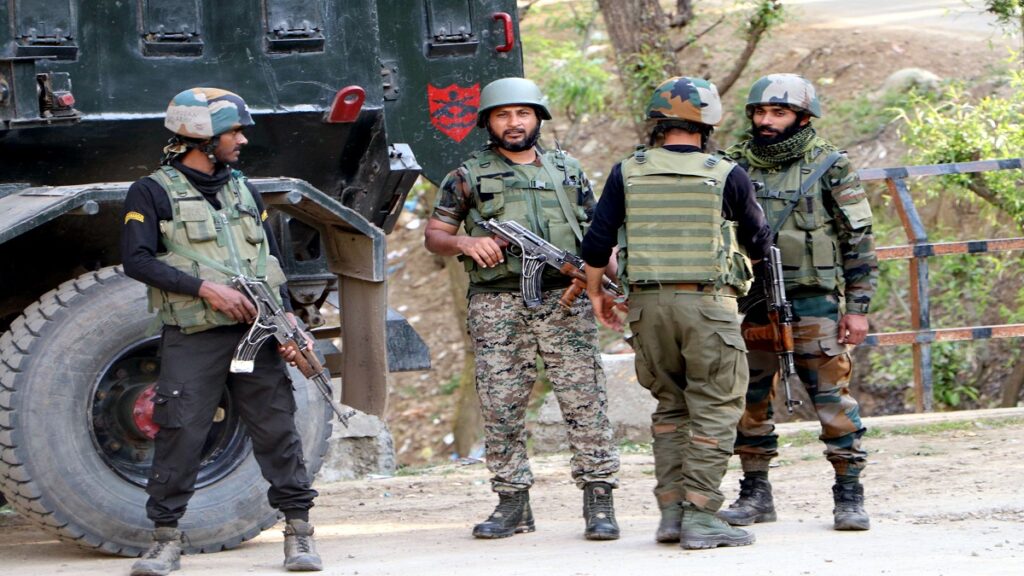 Srinagar, April 16 (ANI): Security personnel stand guard after an encounter with militants in Anantnag district of South Kashmir, on Saturday. (ANI Photo)