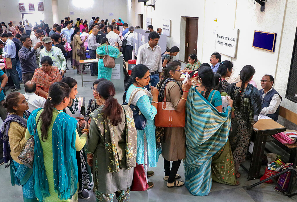 Bhopal: Madhya Pradesh government employees on poll duty wait in a queue to cast their votes for the State Assembly elections, in Bhopal, Monday, Nov. 6, 2023. (PTI Photo)(PTI11_06_2023_000124B)